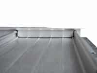 Foam insert within standing seam metal roof profiled sheet
