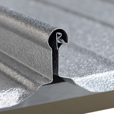 Close up view of the innovative seam design of the R-MER LOC standing seam metal roof system