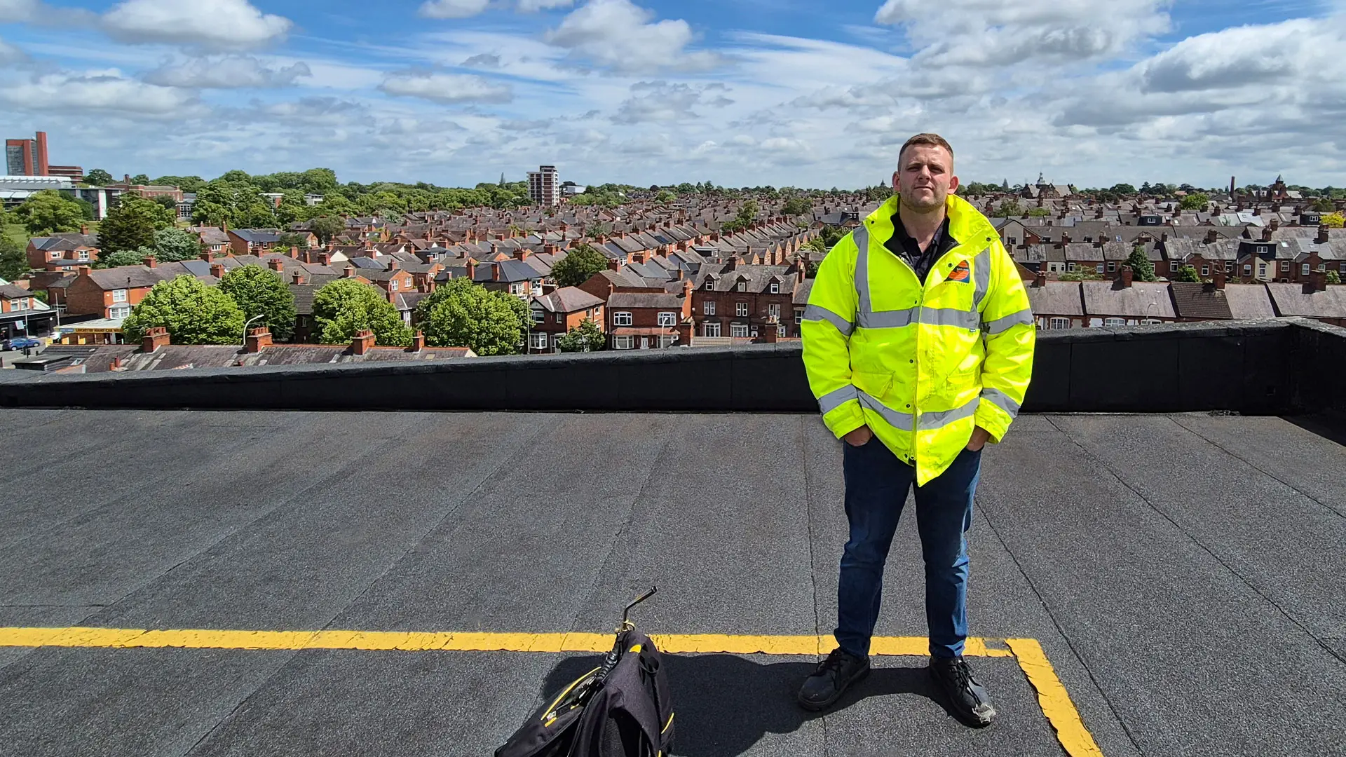 Garland UK Technical Manager Joe Wharton on top of a flat roof overlooking surrounding area
