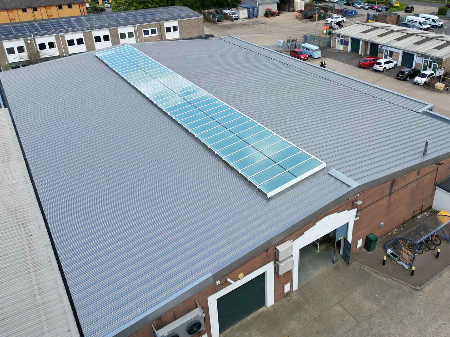 Standing seam metal roof with large glass skylight