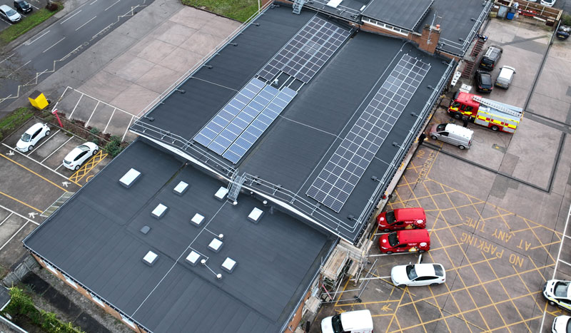 large fire station flat roof with solar panels