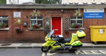 outside red brick police station with police motorcycle