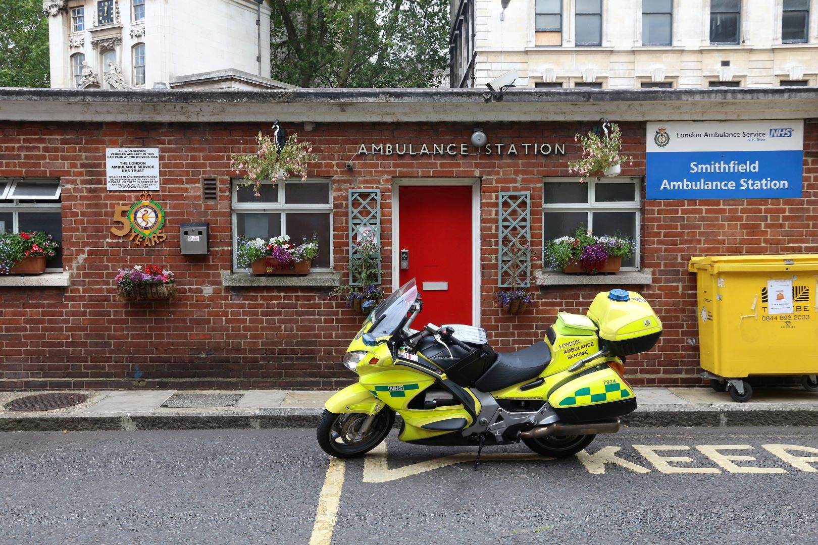 outside red brick police station with police motorcycle