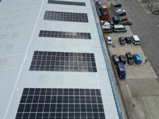 aerial view of the completed R-MER CLAD roof with Solarise solar panels installed, showcasing a clean, modern finish and energy-efficient upgrade.