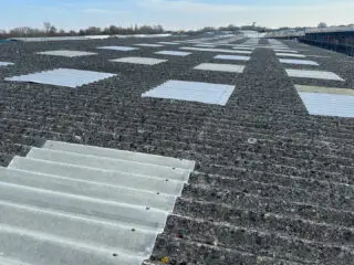 Close up view of the original asbestos roof. The Garland UK solution avoided costly strip-out while encapsulating the asbestos safely and eliminating the risk of fibre release.