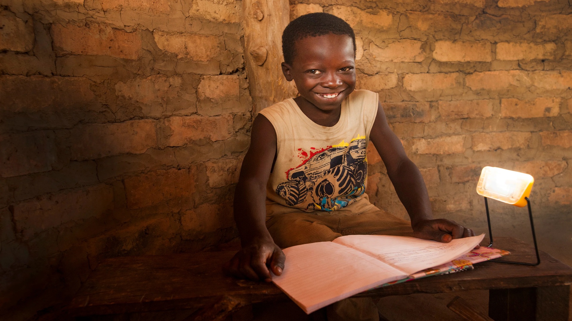 Child with solar pv lights. Project delivers solar lights to Zambian families living without electricity