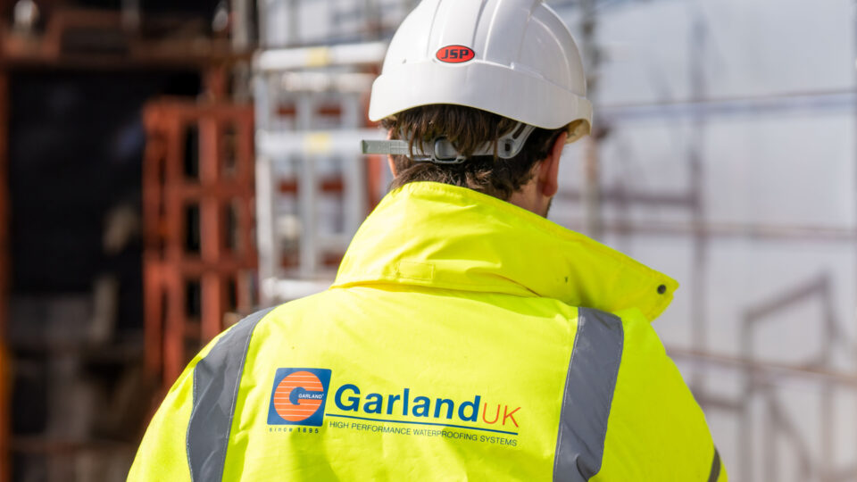 Construction worker wearing Garland UK high-visibility safety gear on site