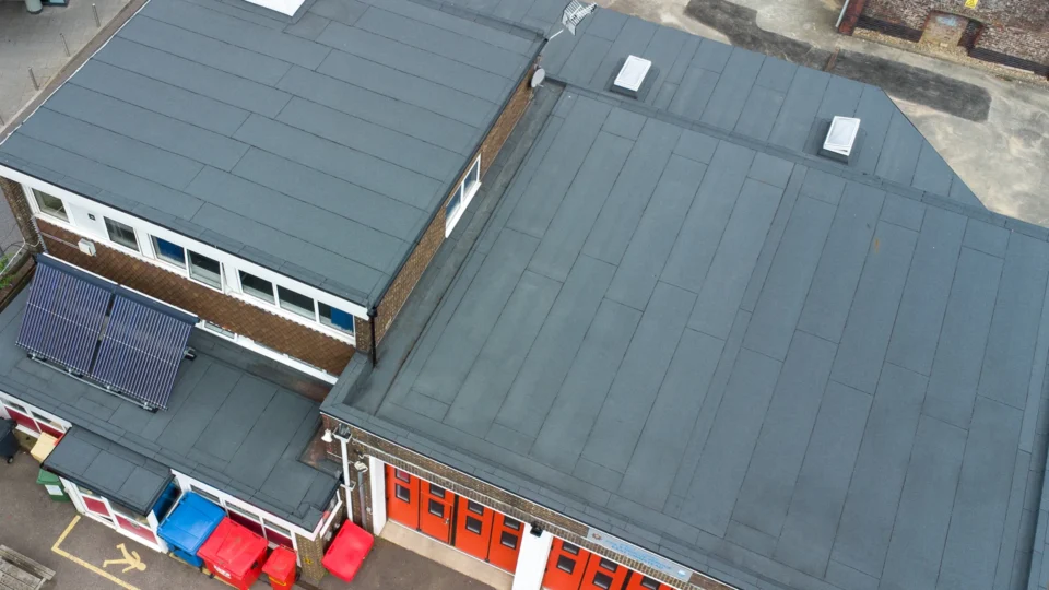 Aerial view East Grinstead fire station with orange garage doors and flat roof