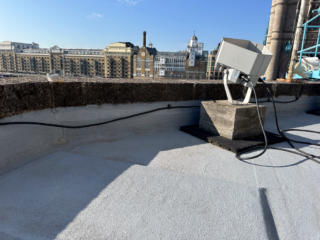 Garland UK Dura-Coat roof refurbishment installation at Tower Bridge ticket office designed to complement the historic structure.