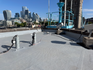 Garland UK heritage roof refurbishment project at London’s Tower Bridge showcasing completed Dura-Coat liquid-applied roofing installation.