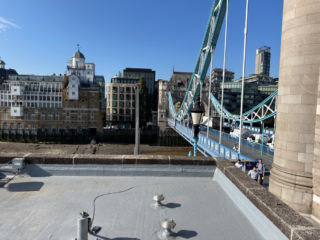 Finished Garland UK roof refurbishment installation at Tower Bridge featuring restored ticket office roof surfaces with Dura-Coat waterproofing system.
