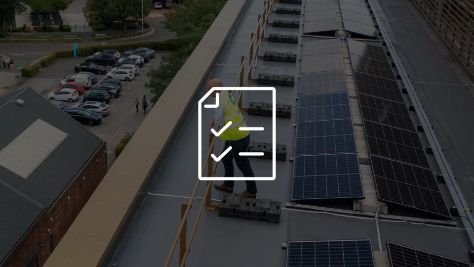 Aerial view of rooftop solar panels with checklist overlay and worker inspection.