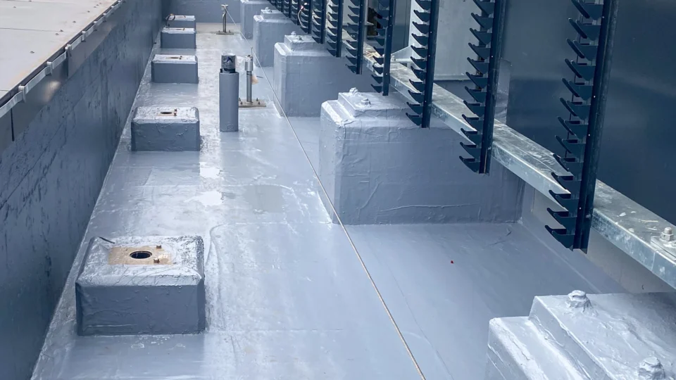 Commercial rooftop with white membrane coating and HVAC equipment installation