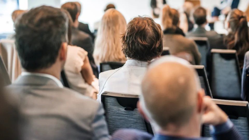 Diverse group of professionals seated in lecture hall during CPD training event
