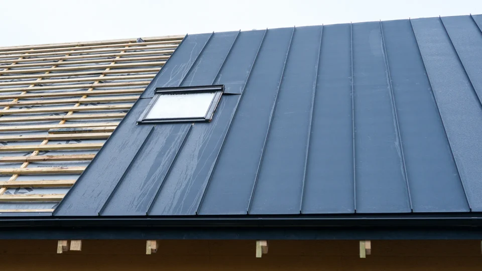Standing seam metal roof with skylight window installation detail