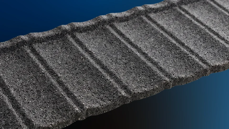 Close-up textured surface of slate tile with diagonal ridges and grooves