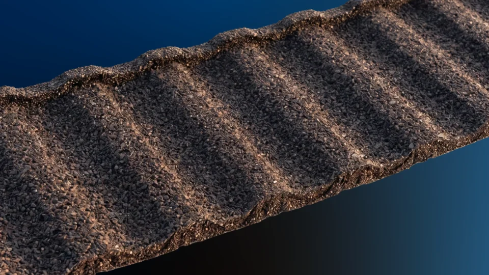 Textured stone tile surface with rippled pattern against blue background