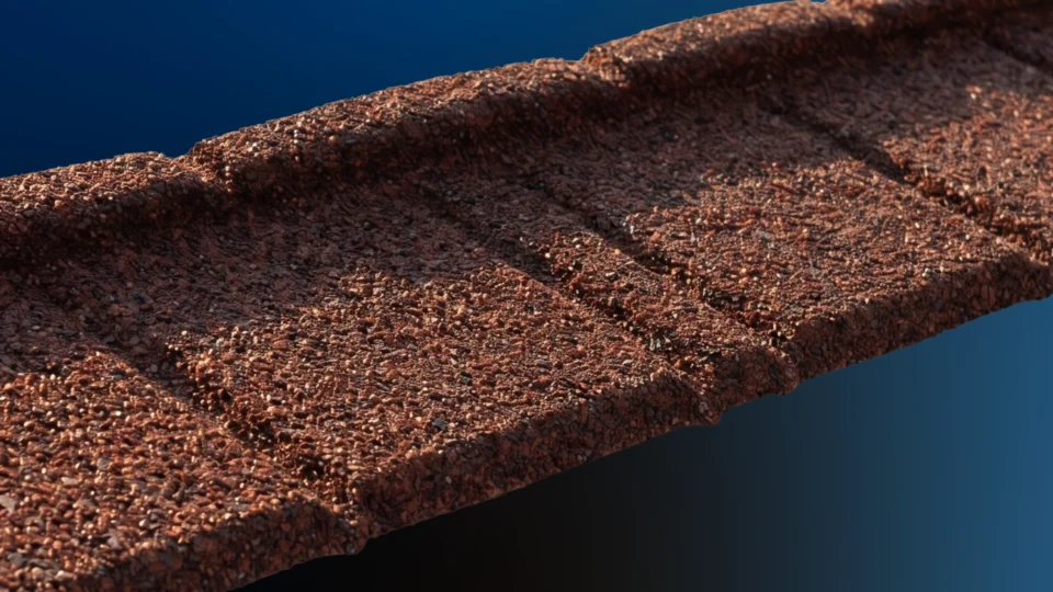 Rusty metal pipe with textured surface against blue background