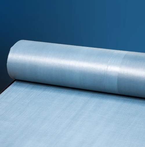 Rolled blue protective base sheet material against dark background