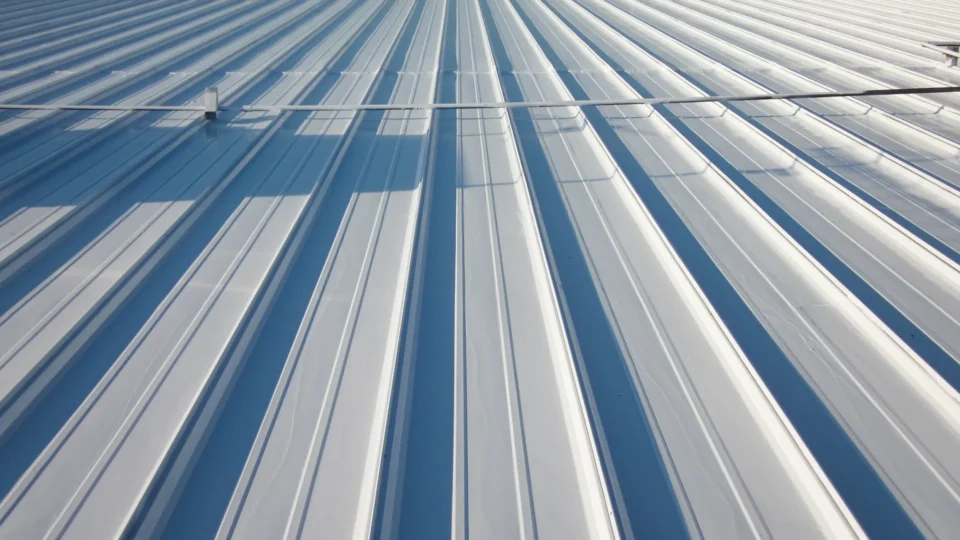 Corrugated metal roof with white and blue striped panels