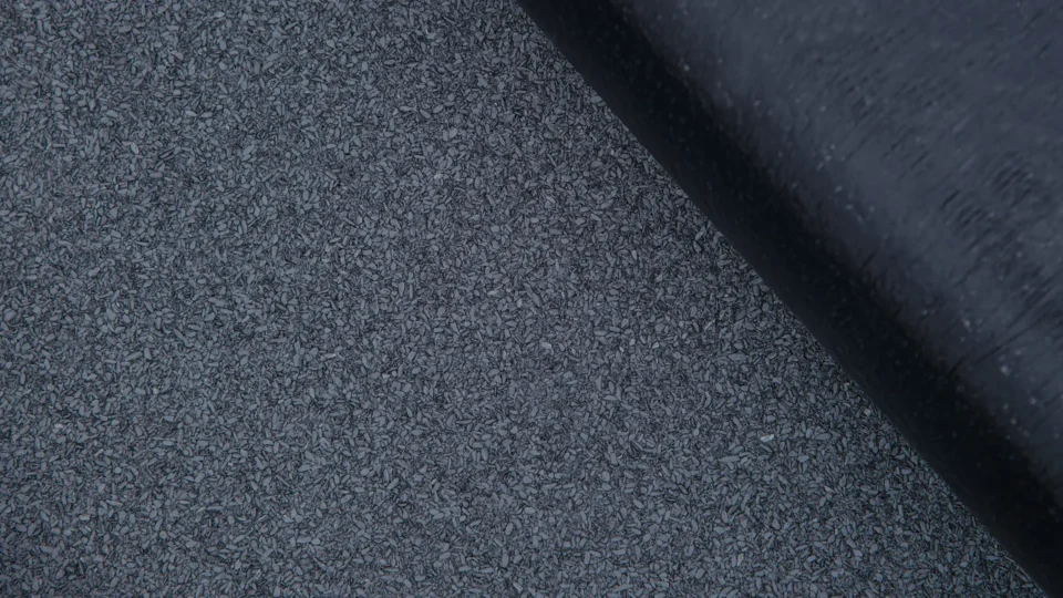 Close-up view of textured gray membrane surface with dark shadow edge