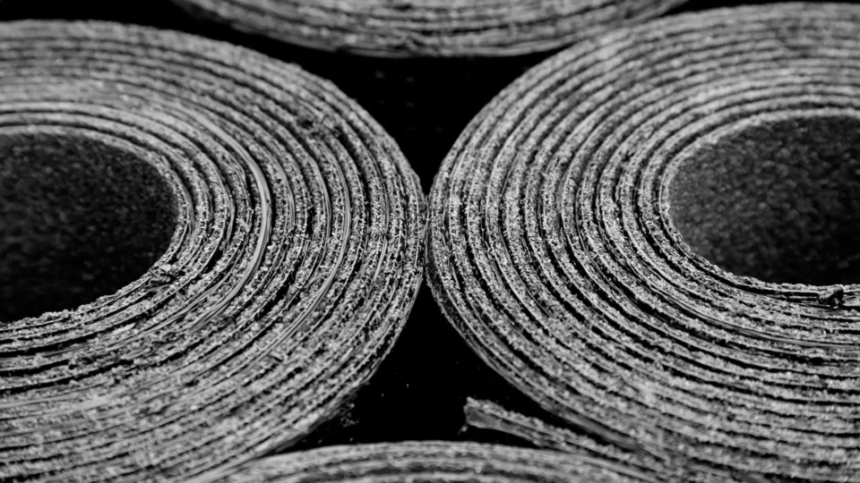 Close-up of reinforced cardboard layers showing concentric circular patterns and texture detail.